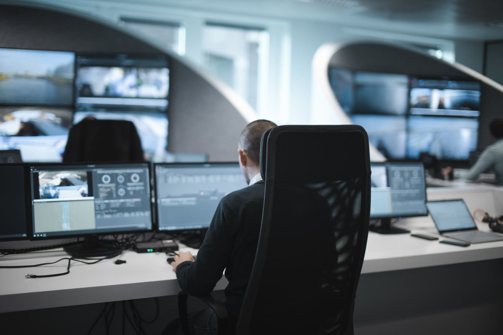 Remote operator monitoring crew support feeds from ROC